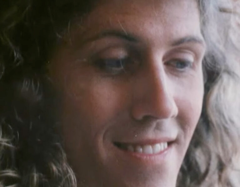 A woman smiling